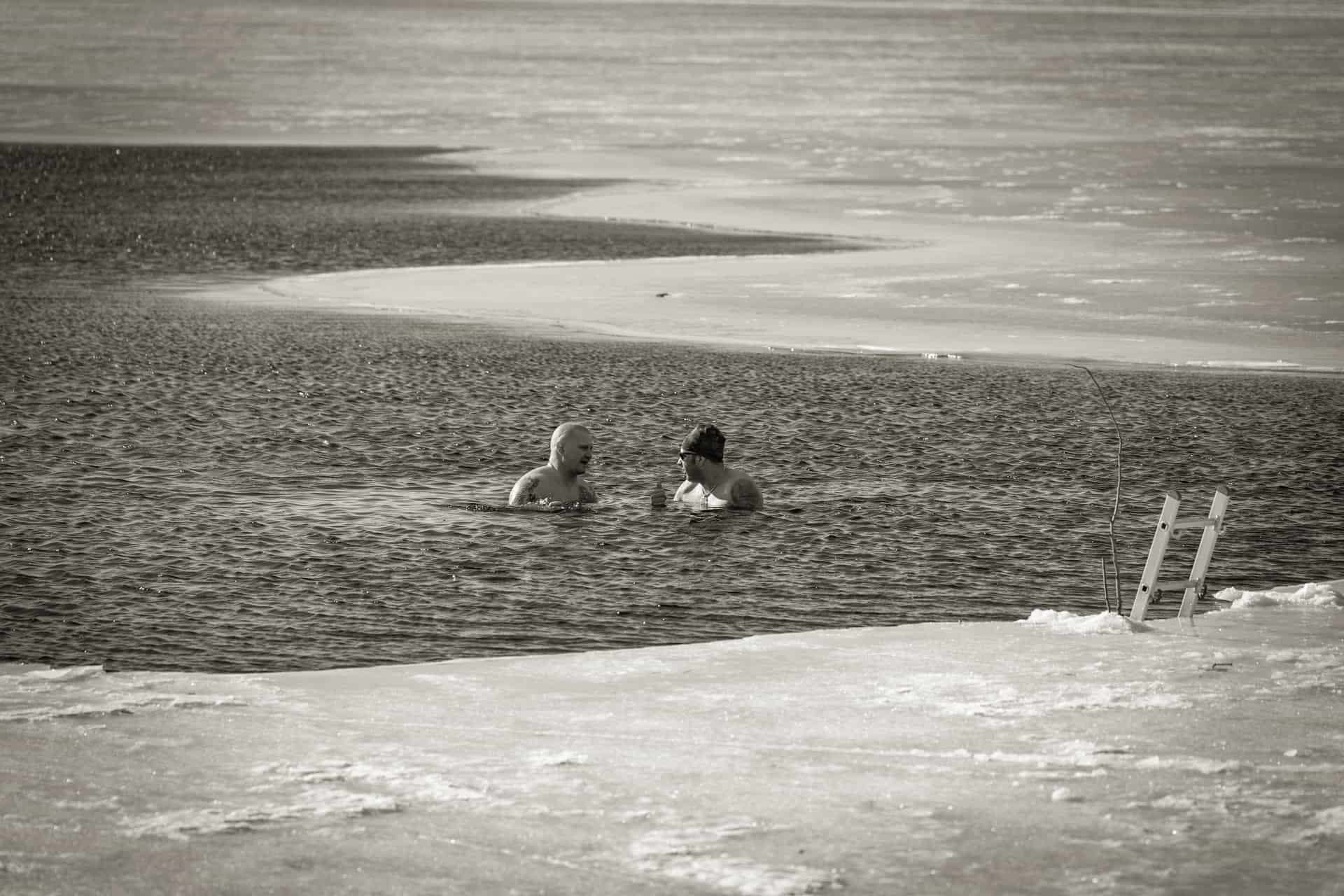 Dark cold water surface in an outdoor plunge tub on a winter morning